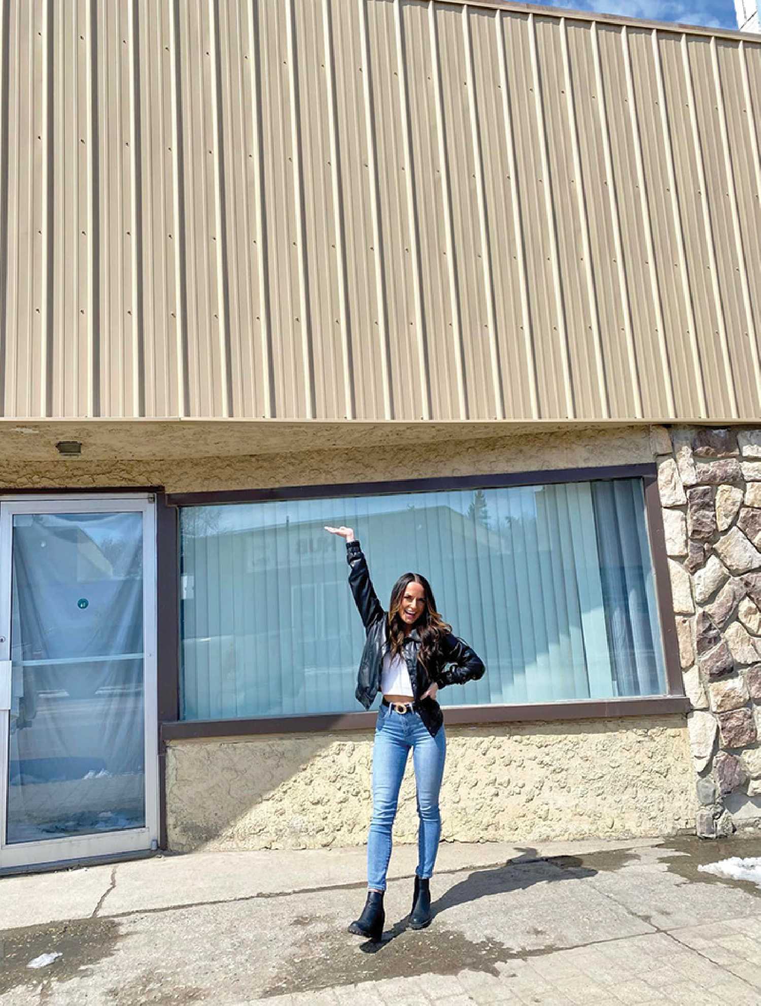Hannah Herman in front of the building where her new clothing store, Haven Clothing, will be.